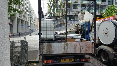 Professional waste clearance team removing construction debris